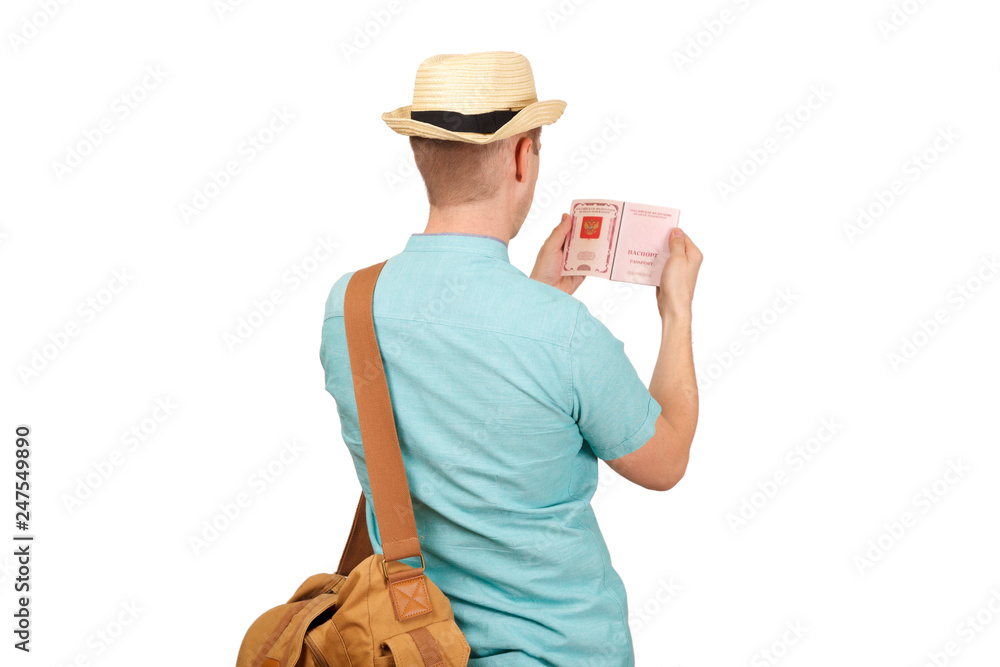 The man looks in the opened international passport. The rear view, from a back The man looks in the opened international passport. The rear view, from a back