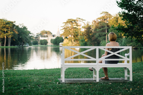 woman sitting on a bench in the park