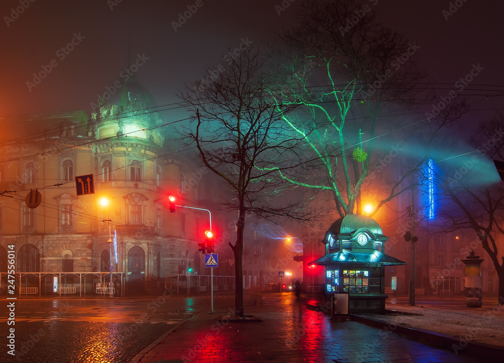 Beautiful nightscape of city center of Lviv, Ukraine at foggy night