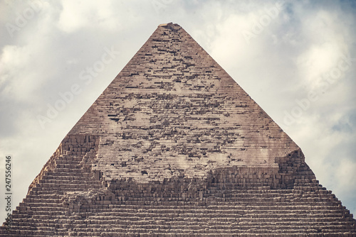 .Elegant view of the top of the pyramid of the cheops on a sunny day in the desert