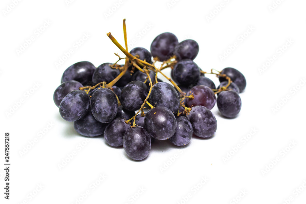 a bunch of dark grapes isolated on white background