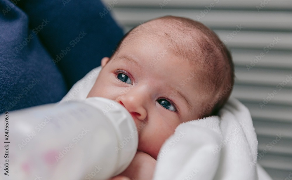 Baby taking feeding bottle Baby taking feeding bottle