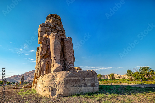 incredibly magnificent and ancient statues of Colossi on the west bank of the Nile. Colossi Memnon in Luxor; luxor; egypr photo