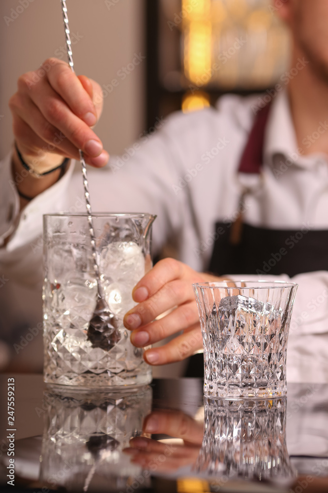 Barmen making negroni alcohol cocktail