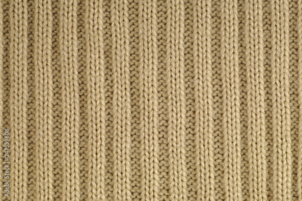 Knitwear. Close-up of a fragment of a knit with a characteristic yarn weave. Knitwear. Close-up of a fragment of a knit with a characteristic yarn weave.