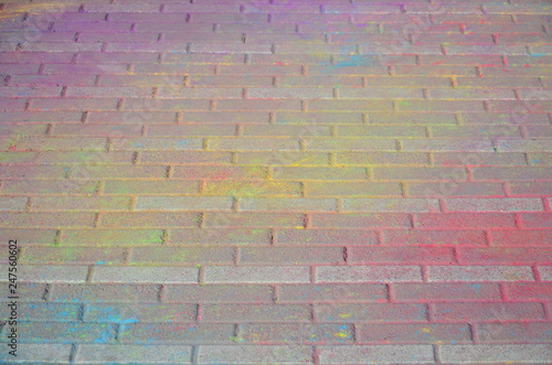 Multi colored paving slabs, powder coated with dry colors at the Holi festival photo