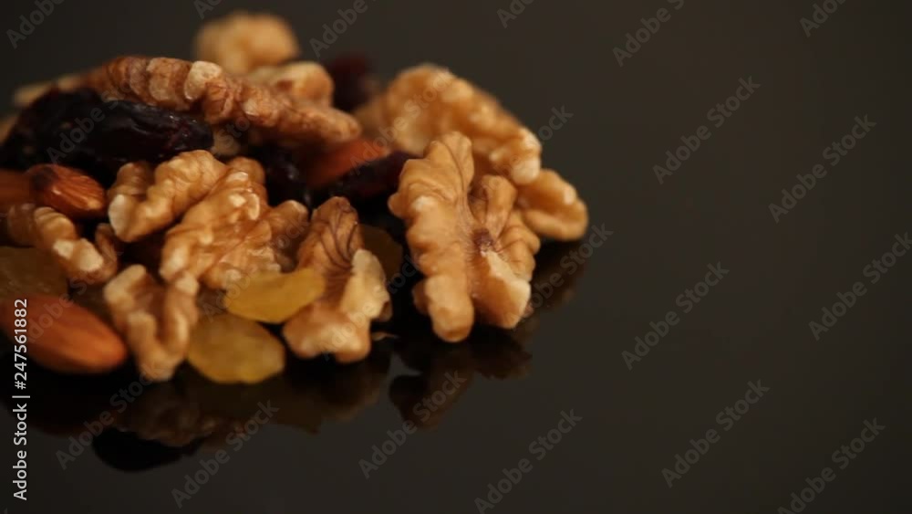 walnuts and raisins on a white background walnuts and raisins on a white background