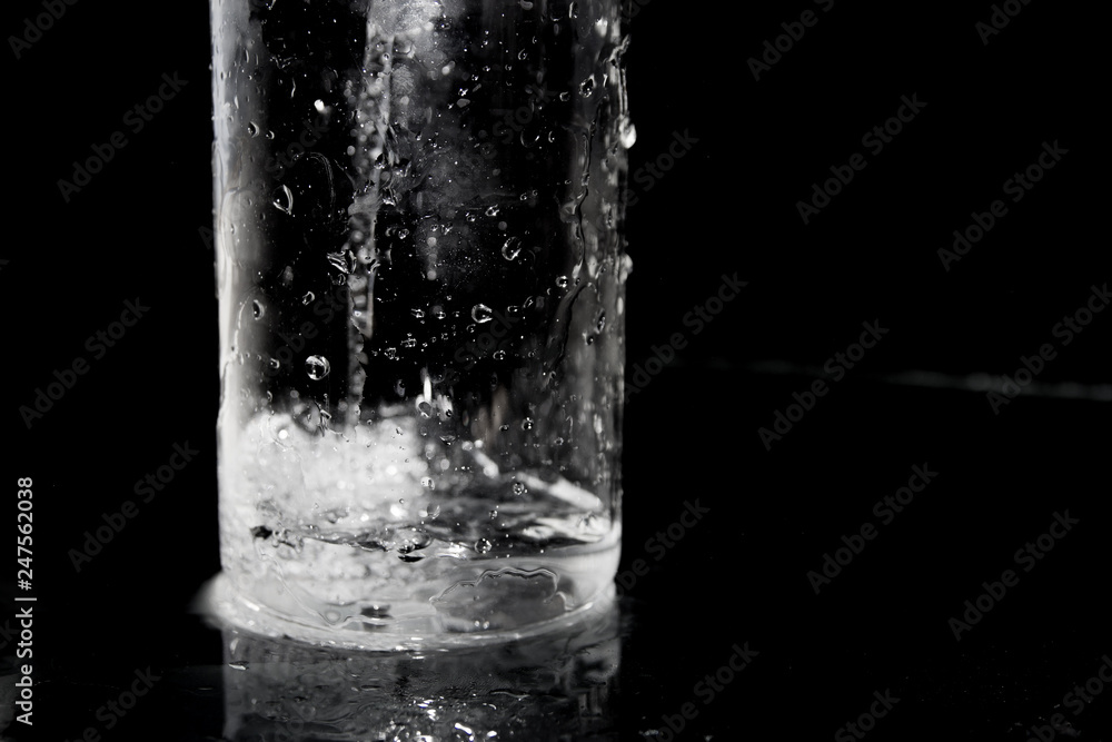 Splash of water on black, Stylish water splash. Isolated on black background, bubbles in the glass, Splash of water on black, Stylish water splash. Isolated on black background, bubbles in the glass,