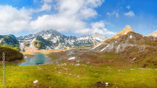 Fototapeta Naklejka Na Ścianę i Meble -  mountain lake in a valley high in montenegro mountains on the way to Bobotov Kuk