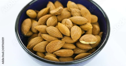 Almond rotating on white background