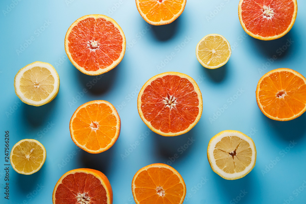 cut in half juicy citruses on a blue background, nice pattern cut in half juicy citruses on a blue background, nice pattern