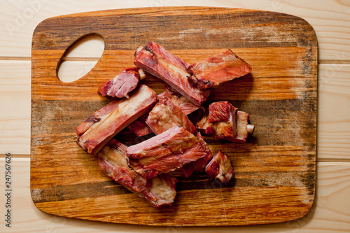 Vászonkép Smoked pork ribs juicy and meaty on a wooden cutting board