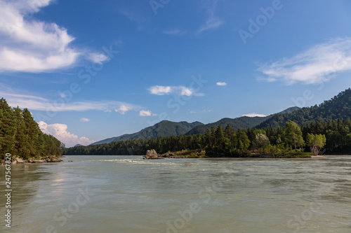 Coast of the mountain rivers Katun during high water in Altai, Russia
