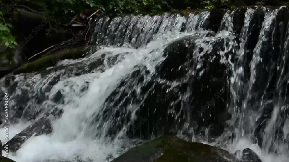 stormy streams of a mountain river flow through stones stormy streams of a mountain river flow through stones