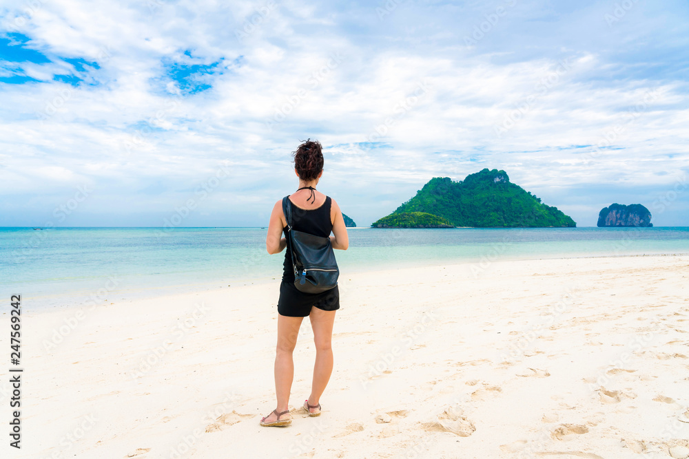 Woman on Beautiful Tropical Beach PP Island, Krabi, Phuket, Thailand blue ocean background girl items vacation accessories for holiday or long weekend a guide choice idea for planning travel Woman on Beautiful Tropical Beach PP Island, Krabi, Phuket, Thailand blue ocean background girl items vacation accessories for holiday or long weekend a guide choice idea for planning travel