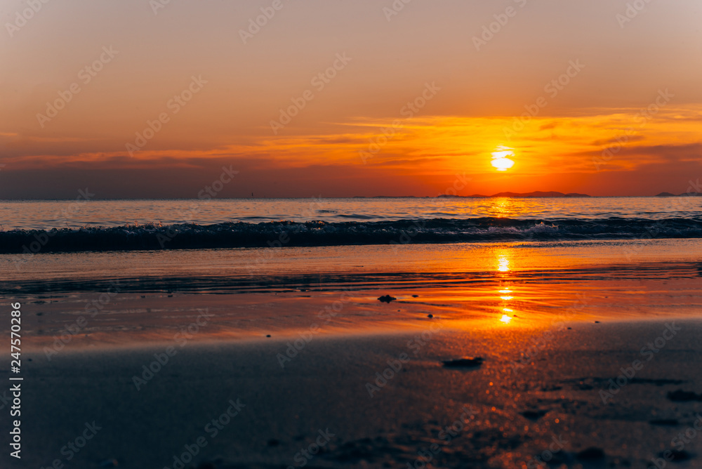 Fototapeta premium Beautiful blazing sunset landscape and orange sky above it,summer background.