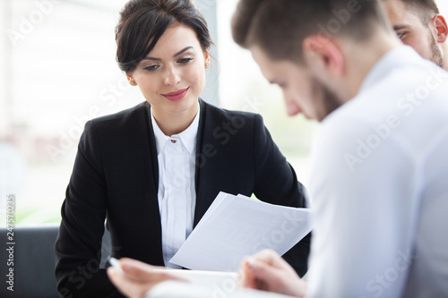 Corporate business team meeting in a modern open plan office