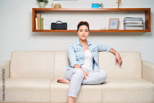 Free Download Woman sitting on sofa - GFXLoad