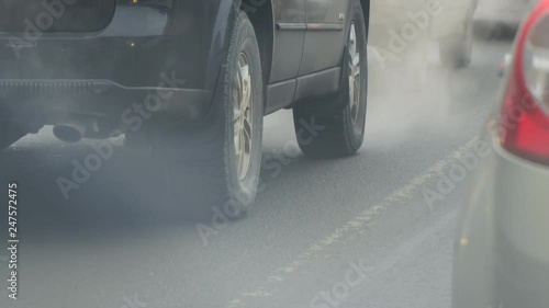 Cars in traffic. Exhaust fumes from the exhaust pipe