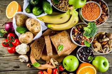 Healthy food. Selection of good carbohydrate sources, high fiber rich food. Low glycemic index diet. Fresh vegetables, fruits, cereals, legumes, nuts, greens.  copy space