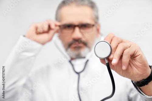 Stethoscope close up, doctor showing medical equipment.