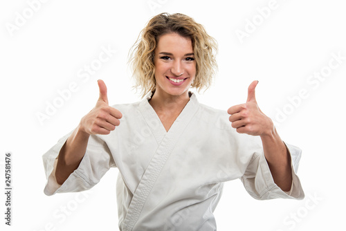 Wallpaper Mural Portrait of female wearing martial arts uniform showing double like gesture Torontodigital.ca