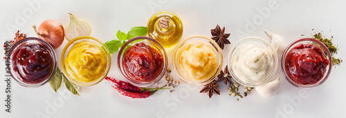 Variety of dips, marinades and sauces with spices photo