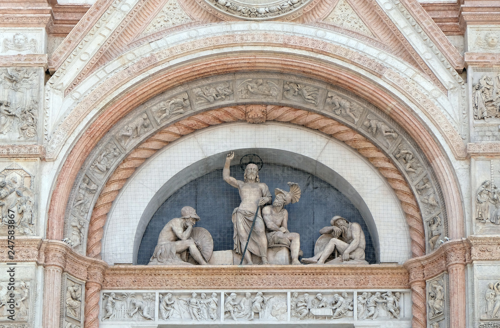 Lunette of the Resurrection, facade of San Petronio Basilica by Alfonso Lombardi in Bologna, Italy
