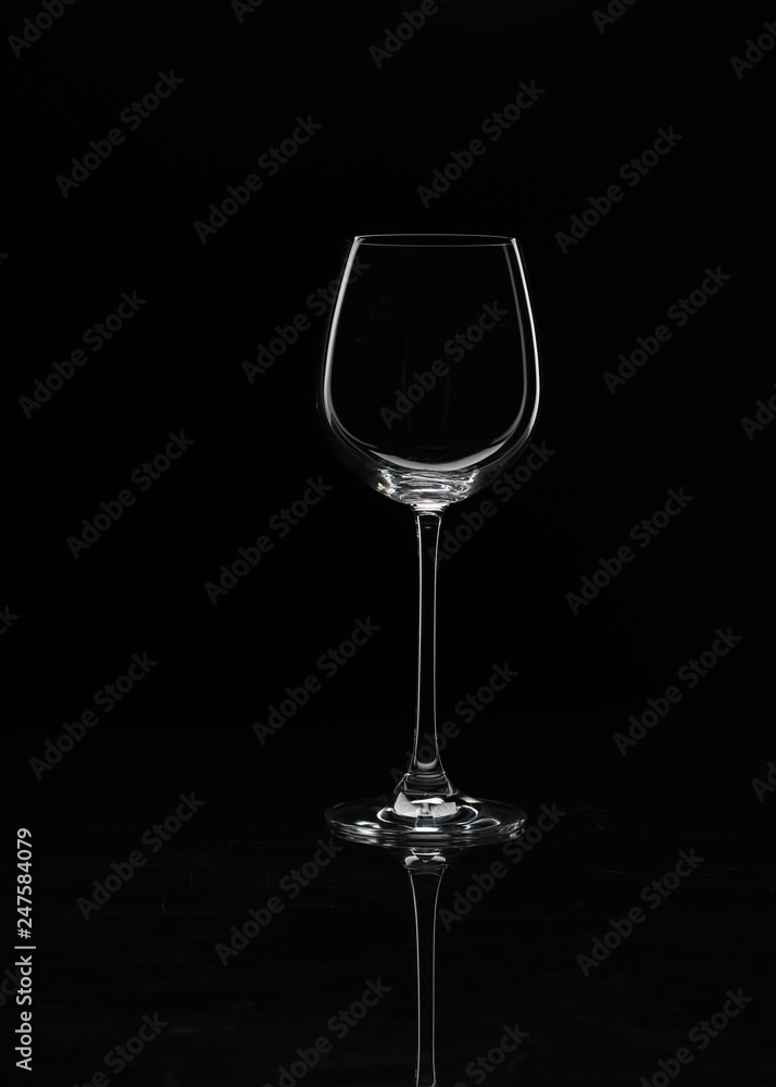 Wine glass on a black background without glare close-up