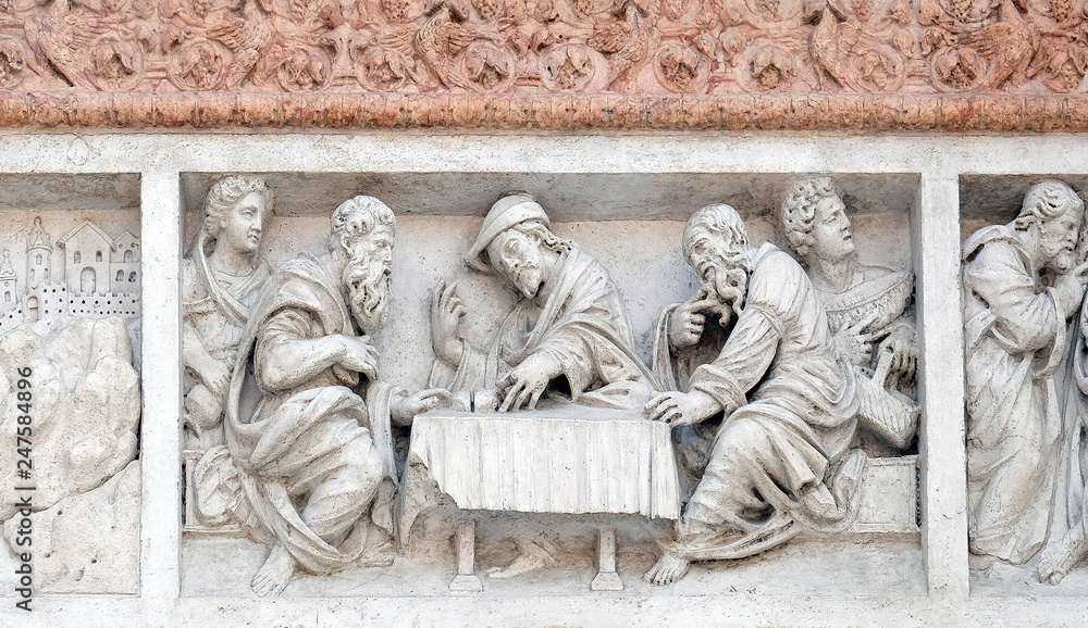 Supper at Emmaus by Zaccaria da Volterra, door of San Petronio Basilica in Bologna, Italy