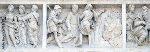 Jesus accompanies the journey of the disciples by Zaccaria da Volterra, door of San Petronio Basilica in Bologna, Italy photo