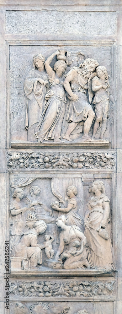 Escape of Loth by Niccolo Tribolo up and Birth of Esau and Jacob by Alfonso Lombardi down, left door of San Petronio Basilica in Bologna, Italy