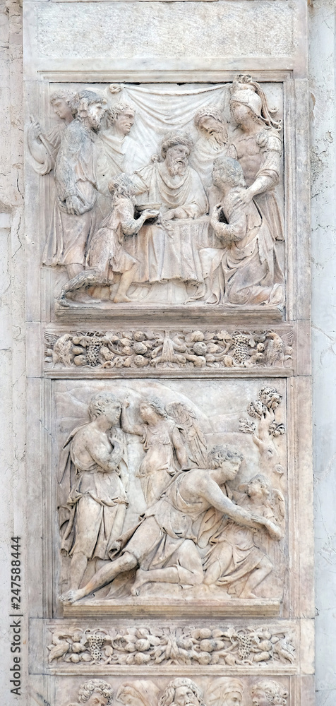 Jacob and the Angel by Niccolo Tribolo up and Benjamin brings the cup to Pharaoh by Francesco da Milano, left door of San Petronio Basilica in Bologna, Italy