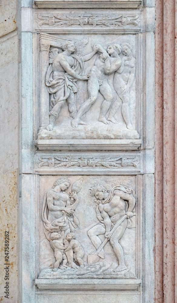 Expulsion from Paradise up, the work of Adam and Eve down, panel by Jacopo della Quercia on the central door of San Petronio Basilica in Bologna, Italy