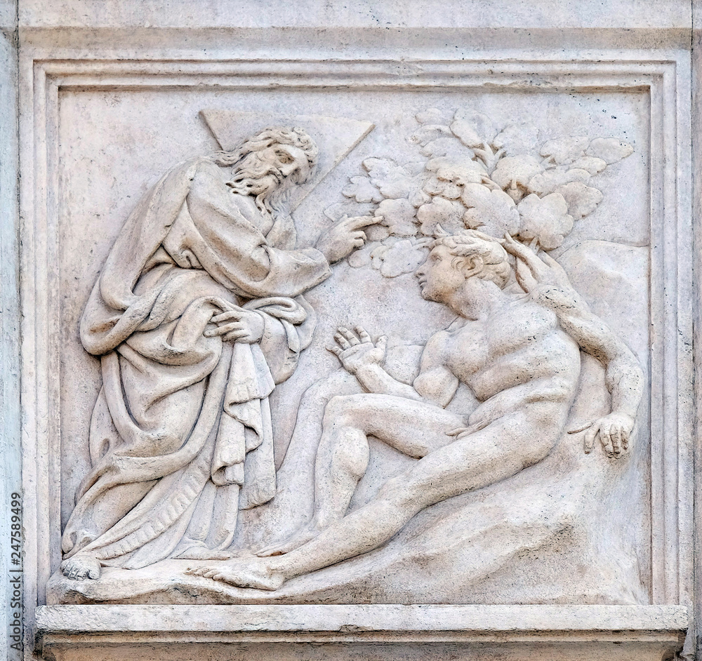 Creation of Adam, Genesis relief on portal of Saint Petronius Basilica in Bologna, Italy