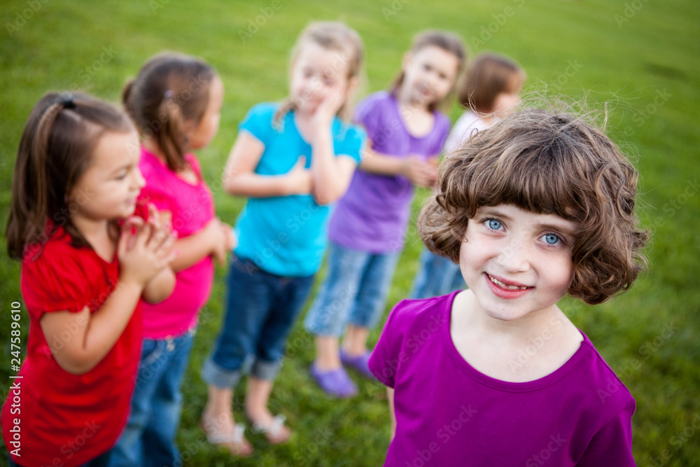 Happy Girl Standing with Friends Outside Happy Girl Standing with Friends Outside