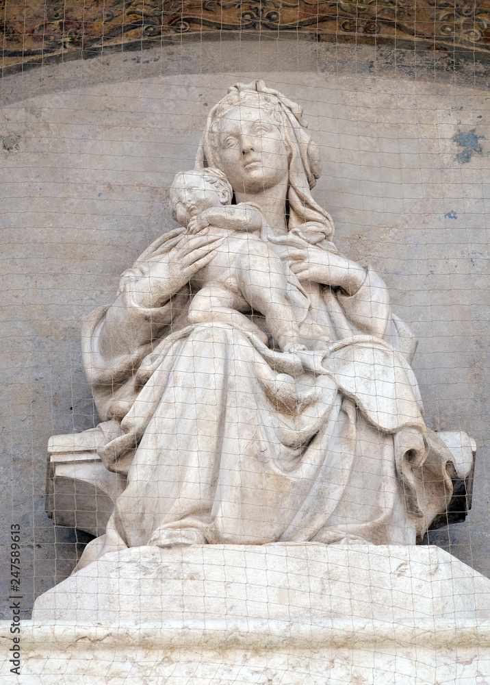 Madonna and Child with Saints, Lunette of San Petronio Basilica by Jacopo della Quercia in Bologna, Italy