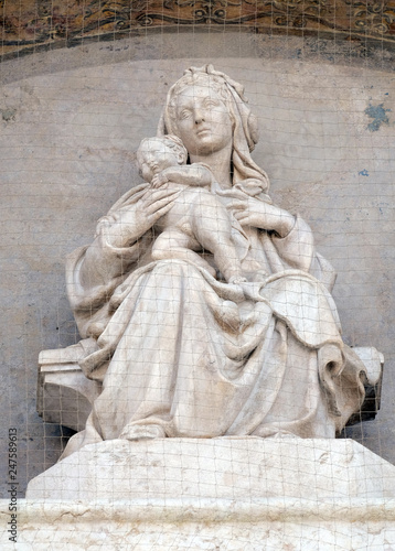 Madonna and Child with Saints, Lunette of San Petronio Basilica by Jacopo della Quercia in Bologna, Italy