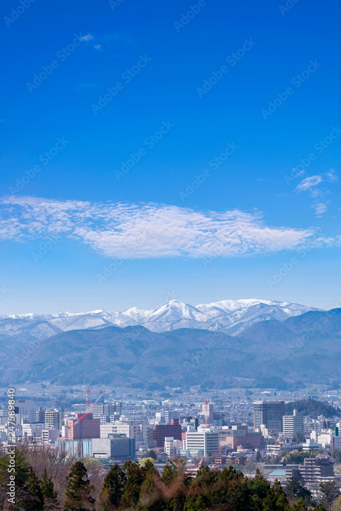 Fukushima cityscape view from Hanamiyama park, in Fukushima, Tohoku area, Japan. The park is very famous Sakura view spot Fukushima cityscape view from Hanamiyama park, in Fukushima, Tohoku area, Japan. The park is very famous Sakura view spot