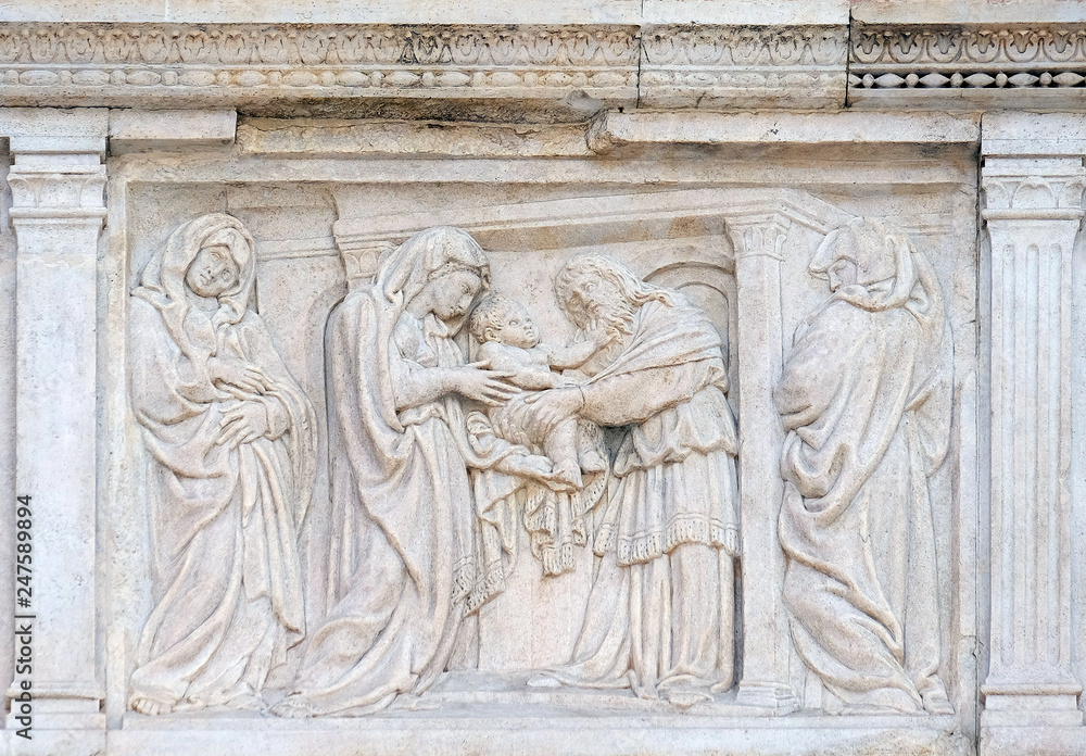 The Presentation in the Temple central door of San Petronio Basilica in Bologna, Italy