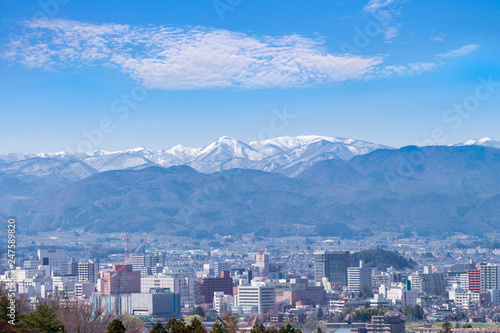 Fukushima cityscape view from Hanamiyama park, in Fukushima, Tohoku area, Japan. The park is very famous Sakura view spot