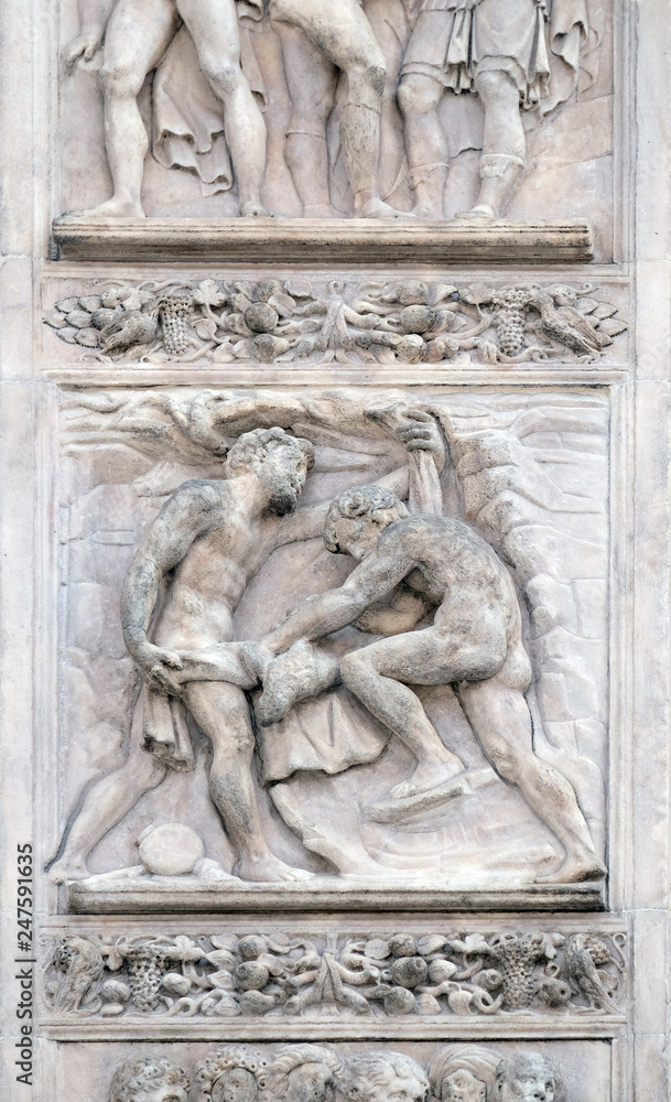 The brothers tinged Joseph's coat with the blood by Giacomo Raibolini, right door of San Petronio Basilica in Bologna, Italy
