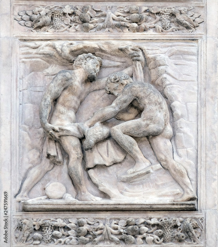 The brothers tinged Joseph's coat with the blood by Giacomo Raibolini, right door of San Petronio Basilica in Bologna, Italy photo