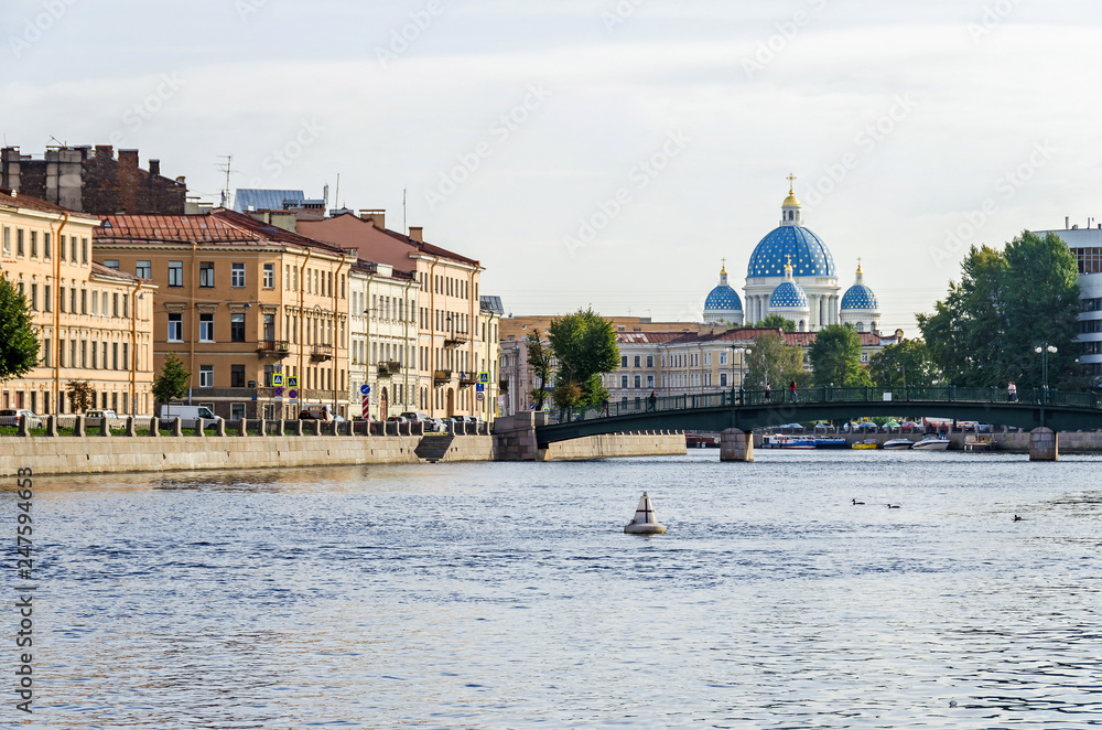 Fontanka river embankment, the English Bridge and the Trinity Cathedral in St.Petersburg, Russia