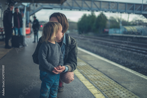 Mother and toddler on station platfom photo