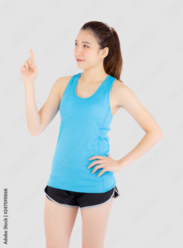 Beautiful portrait young asian woman in sport clothing with satisfied and confident isolated on white background, girl asia have wellness finger point something, exercise for fit with health concept. Beautiful portrait young asian woman in sport clothing with satisfied and confident isolated on white background, girl asia have wellness finger point something, exercise for fit with health concept.