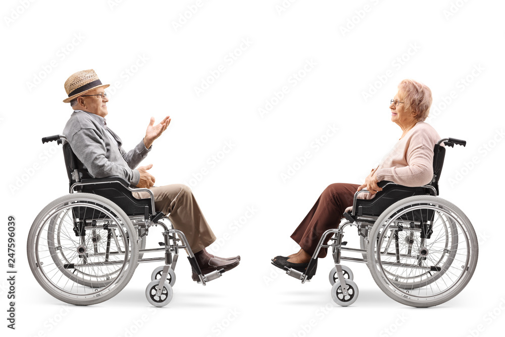 Senior gentlemen in a wheelchair talking to a senior woman in a wheelchair Senior gentlemen in a wheelchair talking to a senior woman in a wheelchair