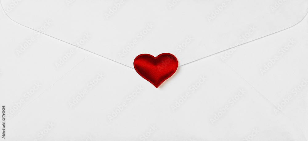 red hearts stamped on white envelope. - Love and care message concept.