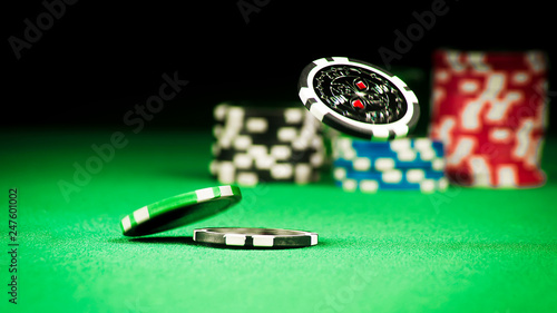 Gambling concept, scattered chips on a green gown