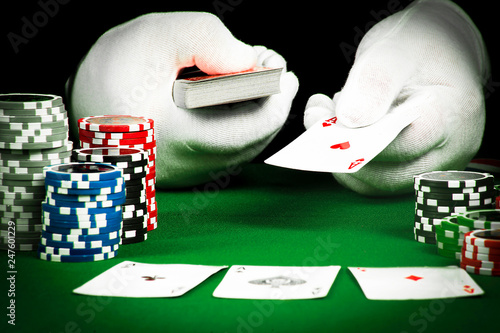 Gambling concept, hand in white gloves holding playing cards